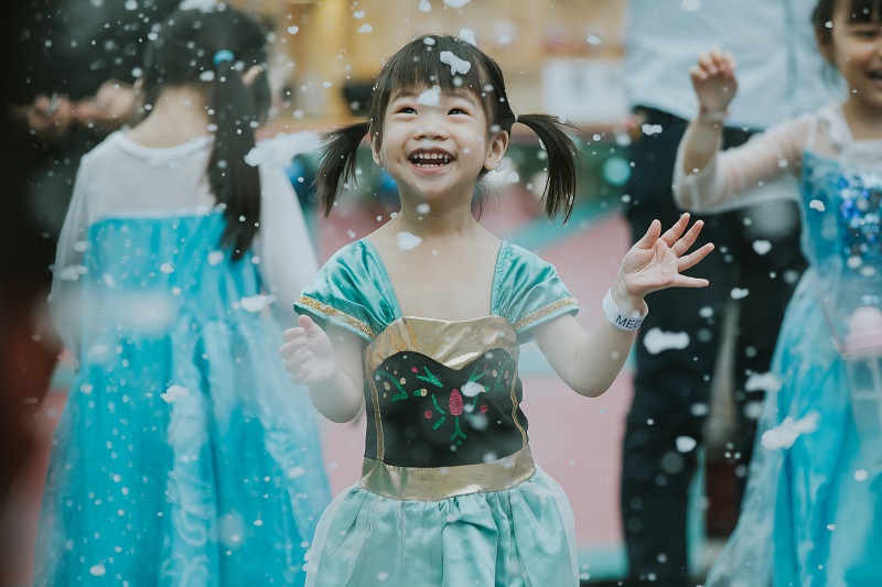 A girl under snowfall